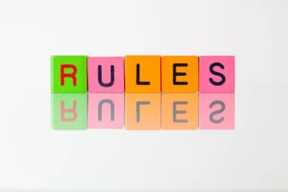 Blocks spelling the word ‘Rules,’ shown right side up and mirrored upside down.
