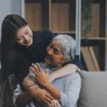 A daughter embracing her aging mother, reflecting elder care planning, fall safety, and dignity.