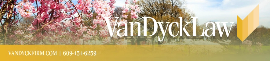 Van Dyck Law Group website banner with cherry blossoms, logo, and contact information.