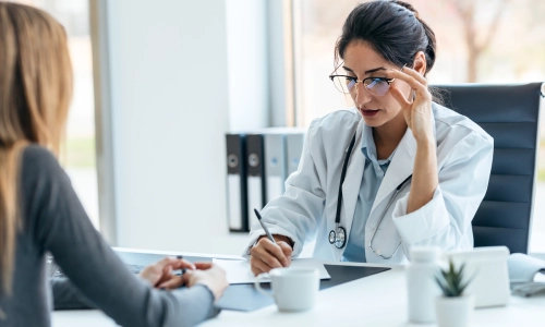 A New Jersey elder law attorney speaking with a medical professional relative to his client’s crisis planning.