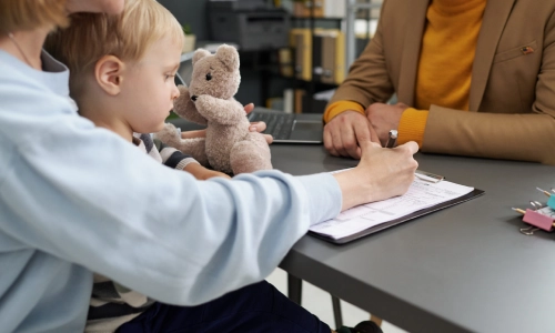 A photo of a mother with her child while consulting a New Jersey lawyer about estate planning.