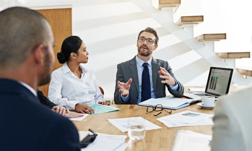 A team of New Jersey lawyers having a meeting about the Medicaid estate recovery cases they are working on.