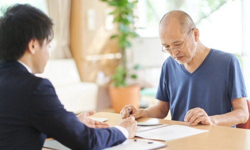 A New Jersey Medicaid planning attorney guiding an elderly client through asset management and long-term care planning.