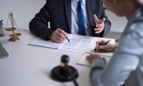 A New Jersey Medicaid planning attorney explaining the Medicaid application process to his client.