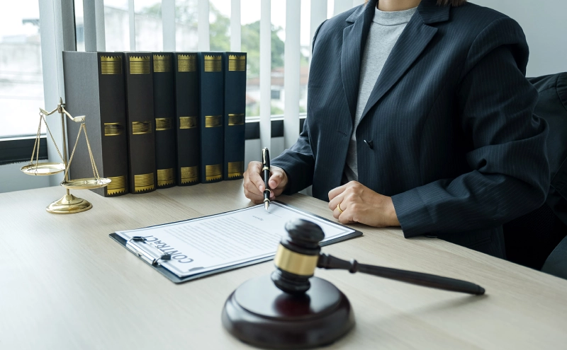 A wills and trusts lawyer reviewing a draft of a will she prepared for a client.